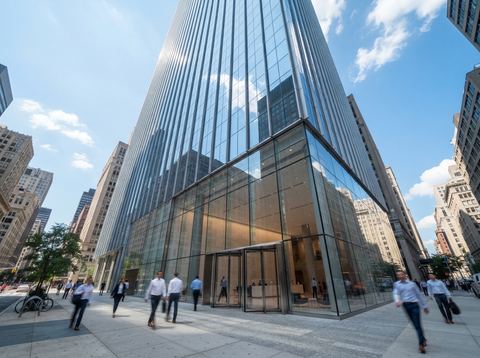 Sunlit corporate office tower representing a major American financial services headquarters.