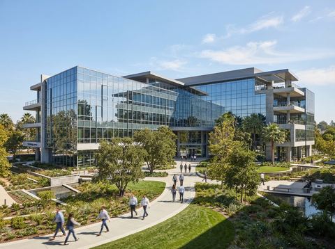 Bright modern glass office building representing a large American software company campus.